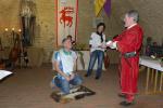 Als „Maler der kleinen Bilder“ empf&auml;ngt Jens-Uwe B&ouml;rner den Ritterschlag durch Otto von Hadmersleben und Burgherr zu Egeln.